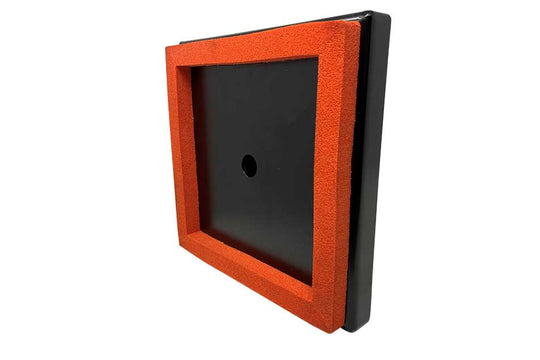 Black square object with a red border on a white background