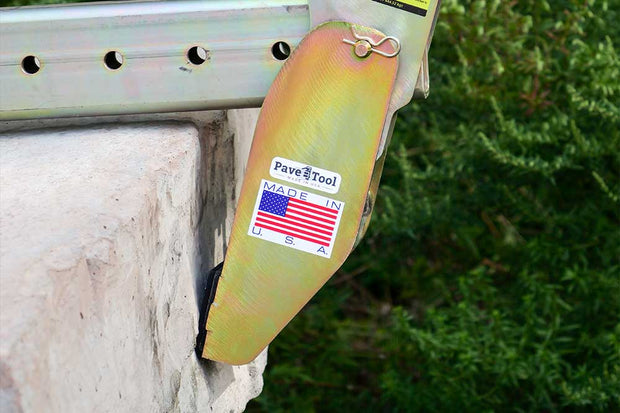 Yellow tool with 'Fave Tool' branding and an American flag on a metal surface.